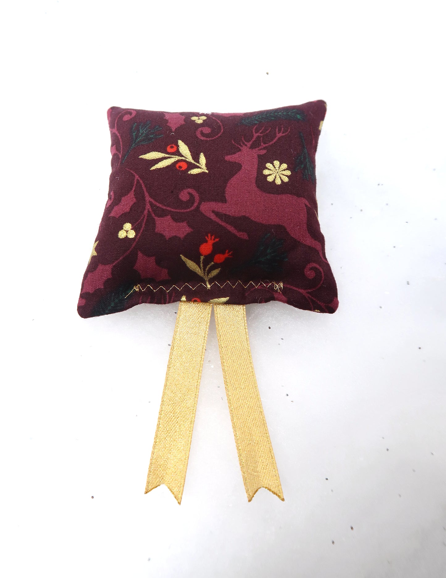 Coussin rennes bordeau doré
